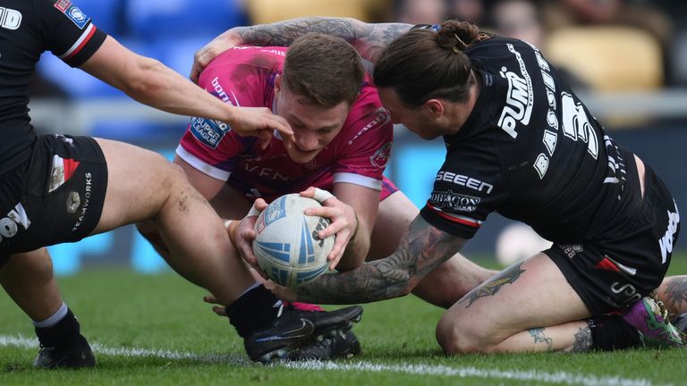 Huddersfield's Sam Halsall goes over for a try in the win over London