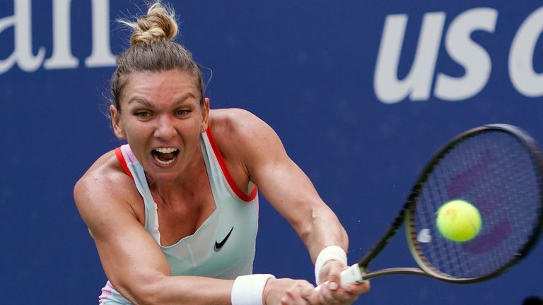 FILE - Simona Halep, of Romania, returns a shot to Daria Snigur, of Ukraine, during the first round of the U.S. Open tennis championships Aug. 29, 2022, in New York. Two-time Grand Slam champion Simona Halep has asked the Court of Arbitration for Sport to overturn the four-year ban she received for doping violations. The court said Tuesday, Oct. 24, 20234 it has registered Halep's appeal of the International Tennis Integrity Agency's decision in September. (AP Photo/Seth Wenig, File)