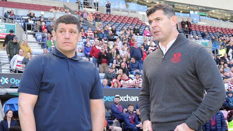 Picture by John Rushworth/SWpix.com - 07/04/2023 - Rugby League - Betfred Super League Round 8 - Wigan Warriors v St Helens - DW Stadium, Wigan, England -  Wigan Warriors' Head Coach Matt Peet (left) and St Helens' Head Coach Paul Wellens talk before the game