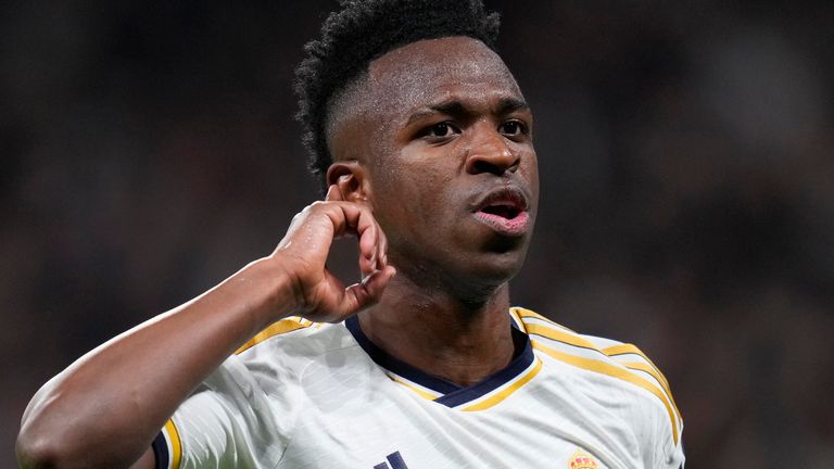 Real Madrid's Vinicius Junior celebrates after scoring his side's opening goal during the Champions League round of 16 second leg soccer match between Real Madrid and RB Leipzig at the Santiago Bernabeu stadium in Madrid, Spain, Wednesday, March 6, 2024. (AP Photo/Manu Fernandez)