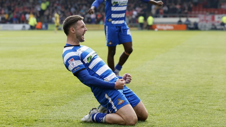 Molyneux slides on his knees after opening the scoring