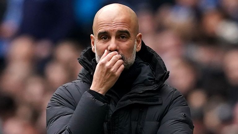 Pep Guardiola looks on from his technical area