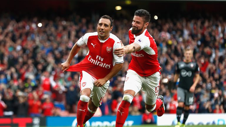 Santi Cazorla of Arsenal celebrates scoring a goal with Olivier Giroud during the Premier League match v Southampton