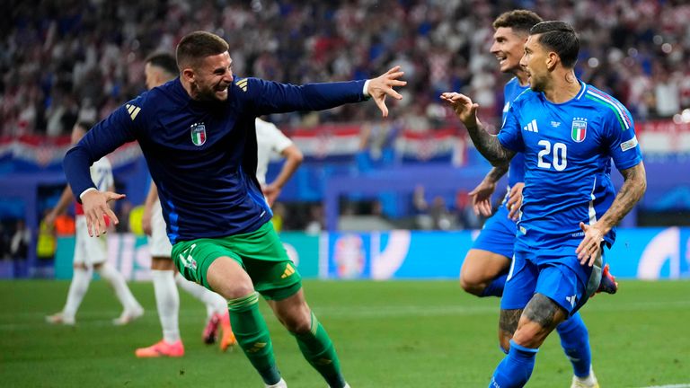 Italy's Mattia Zaccagni, right, celebrates with team mates after scoring during a Group B match between Croatia and Italy at the Euro 2024 soccer tournament in Leipzig, Germany, Monday, June 24, 2024. (AP Photo/Petr David Josek)