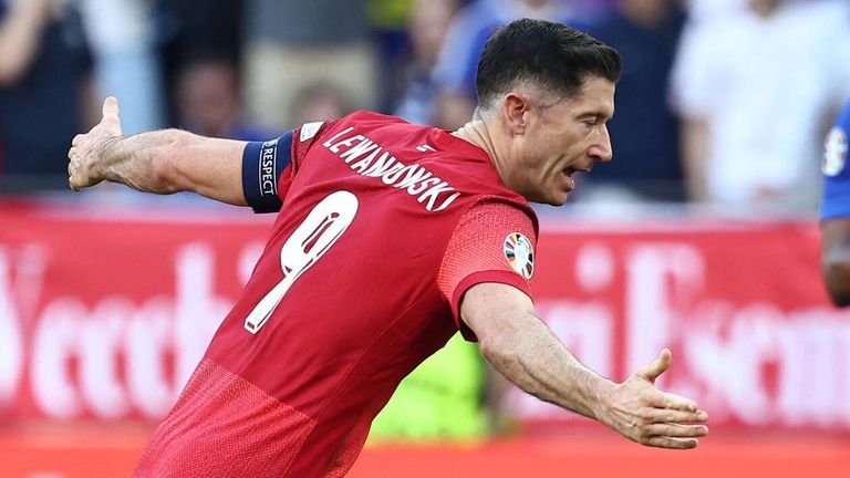 Robert Lewandowski wheels away after equalising for Poland against France