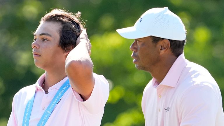 Max Homa talks with Tiger Woods and his son Charlie, on the fifth hole during a practice round for the U.S. Open golf tournament Tuesday, June 11, 2024, in Pinehurst, N.C. (AP Photo/George Walker IV) 