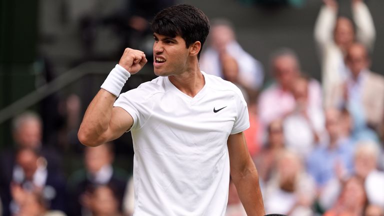 Carlos Alcaraz celebrates winning the second set during his match against Daniil Medvedev on day twelve of the 2024 Wimbledon Championships at the All England Lawn Tennis and Croquet Club, London. Picture date: Friday July 12, 2024.