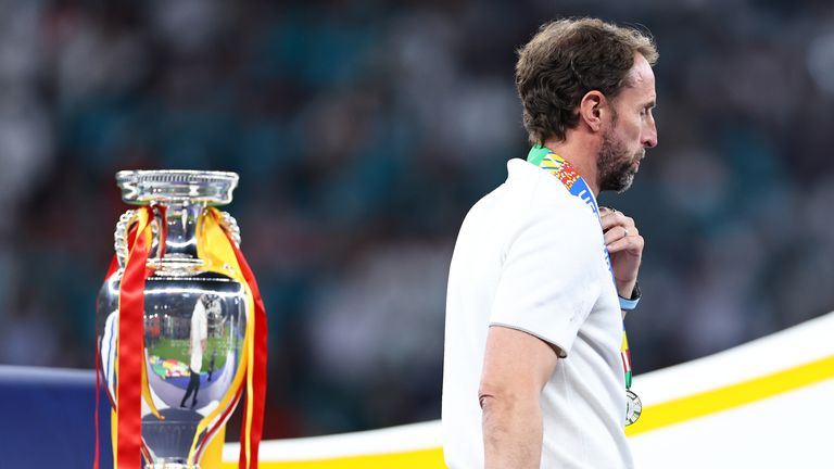 A dejected Gareth Southgate manager / head coach of England walks past the trophy during the UEFA EURO 2024 final match between Spain and England at Olympiastadion on July 14, 2024 in Berlin, Germany