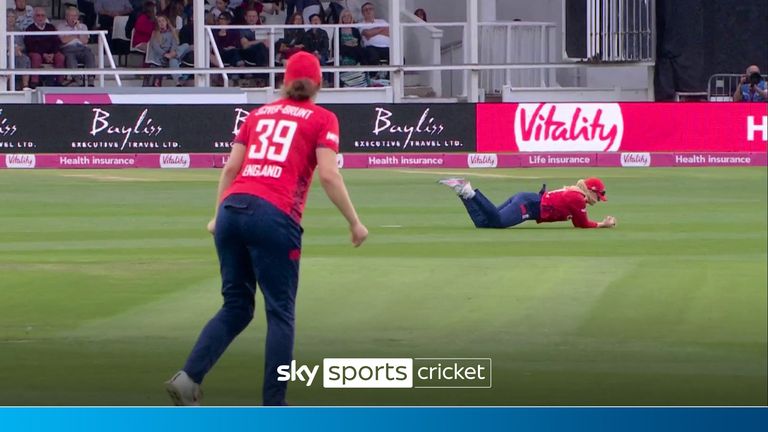 Sarah Glenn takes a sensational diving catch to remove Maddy Green..