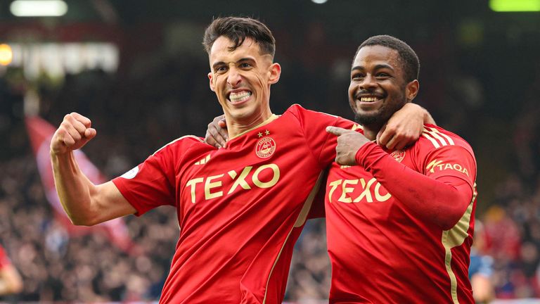 ABERDEEN, SCOTLAND - SEPTEMBER 24: Aberdeen&#39;s Bojan Miovski (L) celebrates scoring to make it 4-0 with teammate Luis Lopes during a cinch Premiership match between Aberdeen and Ross County at Pittodrie, on September 24, 2023, in Aberdeen, Scotland. (Photo by Mark Scates / SNS Group)