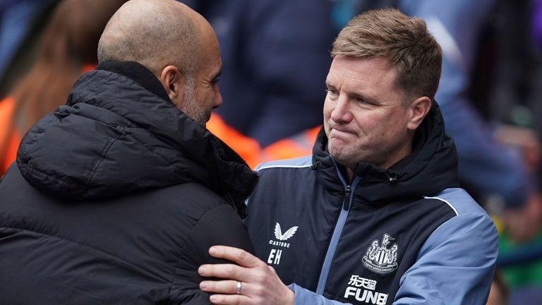 Manchester City's head coach Pep Guardiola, right, hugs with Newcastle's head coach Eddie Howe during the English Premier League soccer match between Manchester City and and Newcastle, at the Etihad stadium in Manchester, England, Saturday, March 4, 2023. (AP Photo/Dave Thompson)