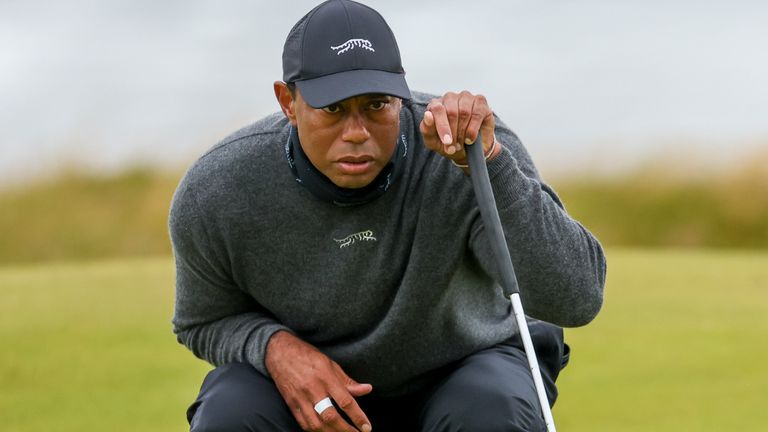 Tiger Woods lines up his putt on the fifth hole during his opening round of the British Open Golf Championships at Royal Troon