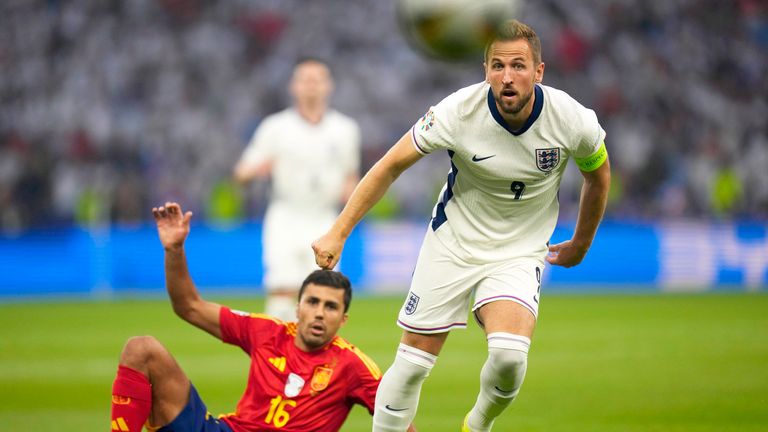 England's Harry Kane, right, and Spain's Rodri eye the ball during the final match between Spain and England at the Euro 2024 soccer tournament in Berlin, Germany, Sunday, July 14, 2024. (AP Photo/Manu Fernandez)