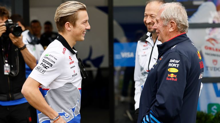 Lawson chatting with Red Bull advisor Helmut Marko and RB chief executive Peter Bayer