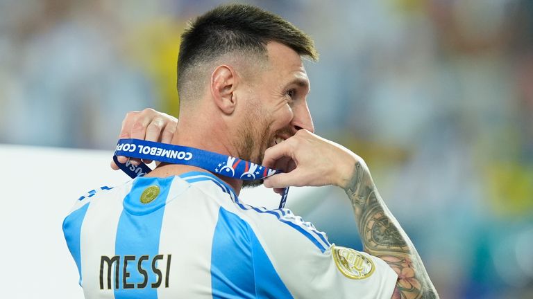 Argentina's Lionel Messi pictured with his winner's medal 