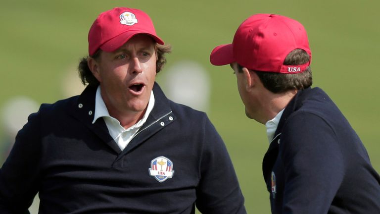 FILE - USA's Phil Mickelson, left, and Keegan Bradley celebrate after winning their foursomes match on the 15th hole at the Ryder Cup PGA golf tournament Friday, Sept. 28, 2012, at the Medinah Country Club in Medinah, Ill. Mickelson has wagered more than $1 billion over the last three decades and wanted to place a $400,000 bet on the 2012 Ryder Cup while playing for Team USA, according to a much-anticipated book by renowned gambler Billy Walters. (AP Photo/Charlie Riedel, File)