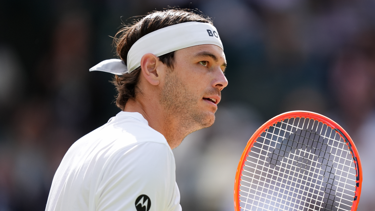 Taylor Fritz in quarter-final action against Lorenzo Musetti at Wimbledon