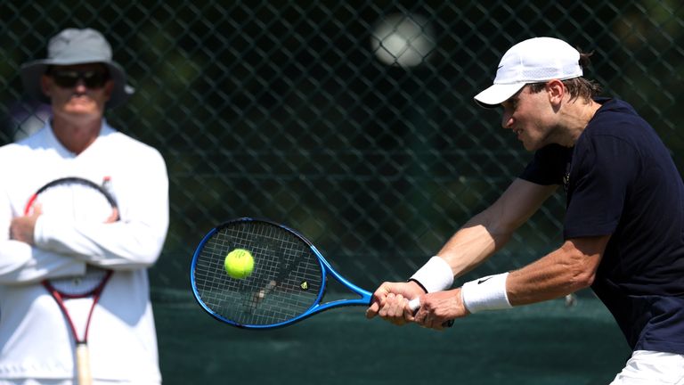 Jack Draper of Great Britain plays a backhand as coach, Wayne Ferreira watches during practice prior to The Championships Wimbledon 2024 at All England Lawn Tennis and Croquet Club on June 26, 2024 in London, England. (Photo by Clive Brunskill/Getty Images)