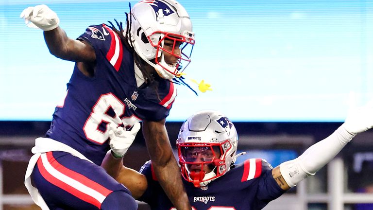 New England Patriots wide receiver JaQuae Jackson, left, celebrates with Kawaan Baker (86) after his touchdown during the second half of a preseason NFL football game against the Carolina Panthers, Thursday, Aug. 8, 2024, in Foxborough, Mass. (AP Photo/Mark Stockwell) 