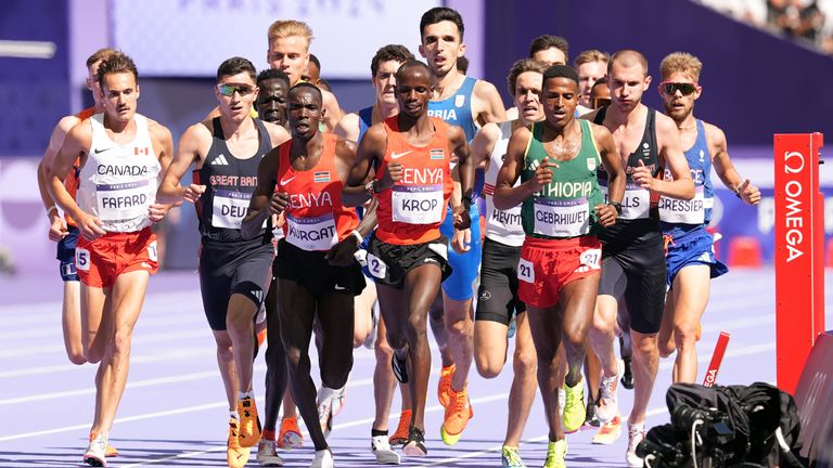 Great Britain's Patrick Dever and George Mills during the men's 5000m heats at the Stade de France