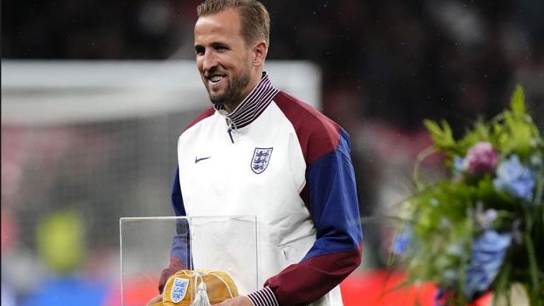 Harry Kane is presented with a special England cap to mark his 100th appearance for his country