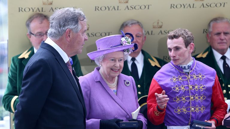 Queen Elizabeth II with Sir Michael Stoute (left) and jockey Ryan Moore after Estimate's victory in the Gold Cup at Ascot