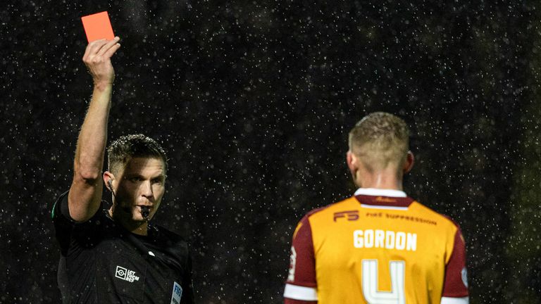 Motherwell's Liam Gordon is shown a red card for his challenge on Celtic's Adam Idah