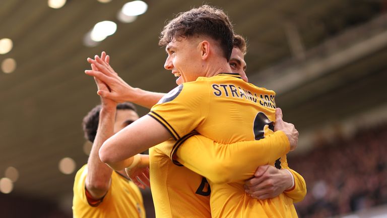 Jorgen Strand Larsen is mobbed by his team-mates after giving Wolves an early lead against Man City