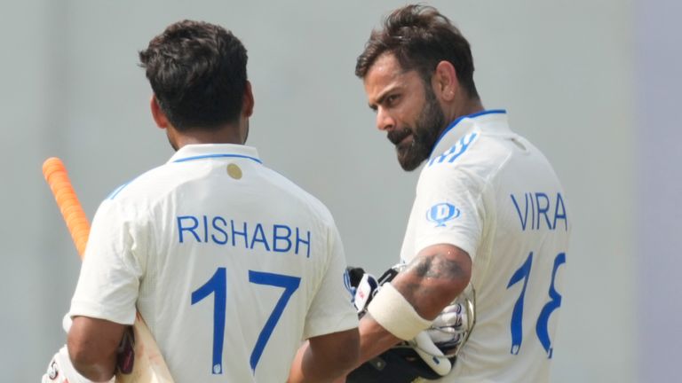 India's Virat Kohli, right, and Rishabh Pant walks towards pavilion after won the second cricket test match against Bangladesh in Kanpur, India, Tuesday, October 1, 2024. (AP Photo/Ajit Solanki) 