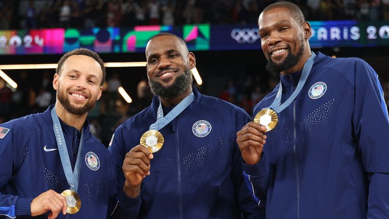 LeBron James pictured with Steph Curry (left) and Kevin Durrant (right) after the USA won their fifth consecutive Olympic gold in men's basketball