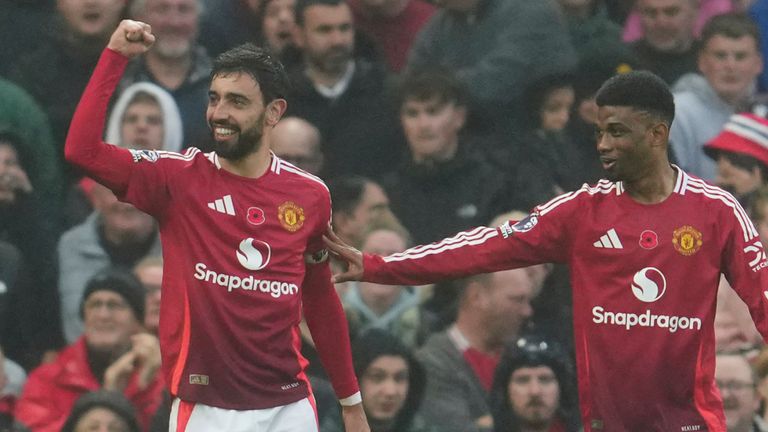 Manchester United's Bruno Fernandes celebrates with his team-mate Amad Diallo after scoring his side's first goal (AP Photo/Jon Super)