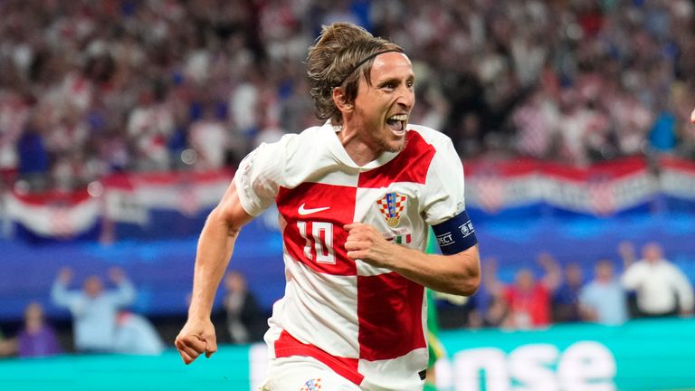 Croatia's Luka Modric celebrates after scoring his side's opening goal during a Group B match between Croatia and Italy at the Euro 2024 soccer tournament in Leipzig, Germany, Monday, June 24, 2024. (AP Photo/Ebrahim Noroozi)